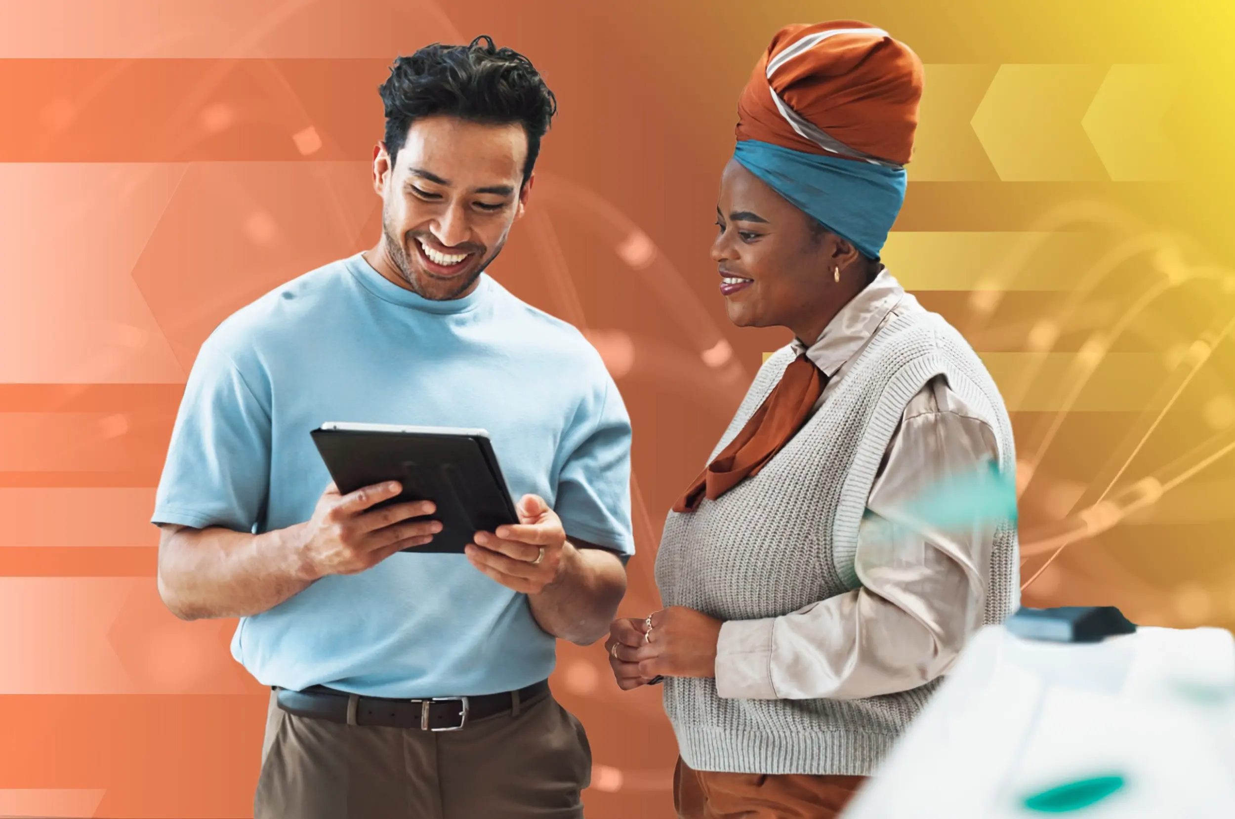 Two people looking at an ipad together with colorful data imagery in the background