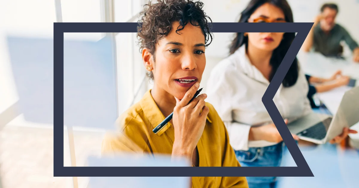 Woman at a whiteboard reimagining Salesforce procurement for public sector agencies.