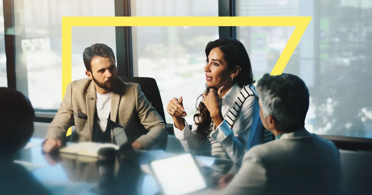 Team discussing their Salesforce merge strategy post-acquisition