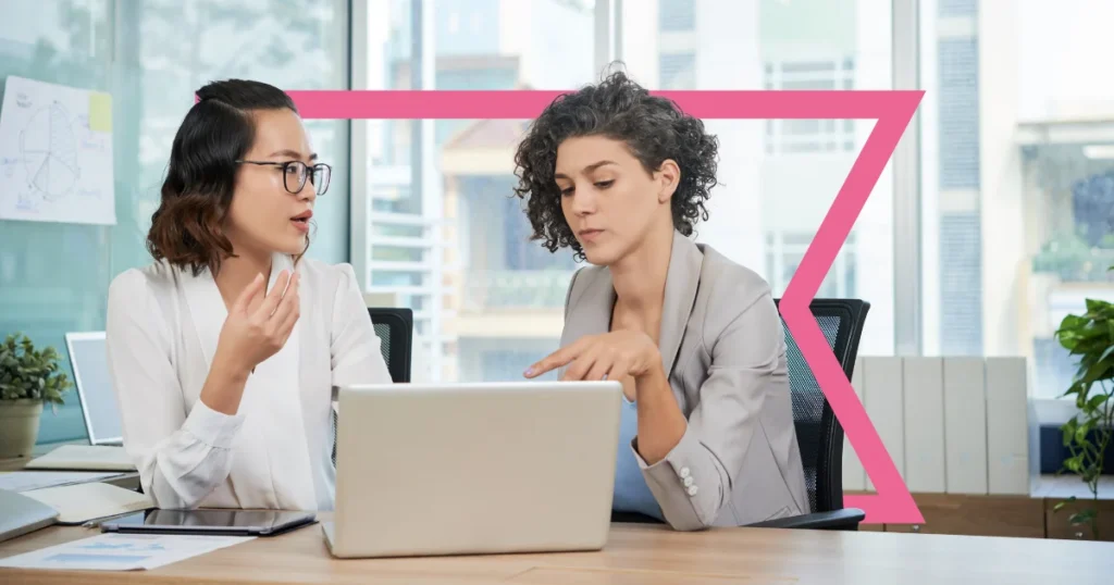 Two businesswomen discussing nCino and Agentforce Financial Services